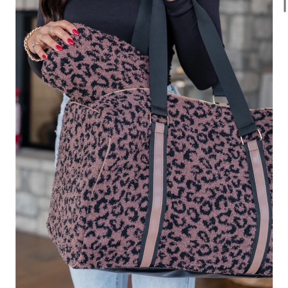 New In Bag! Beige leopard weekender duffle and matching makeup bag.